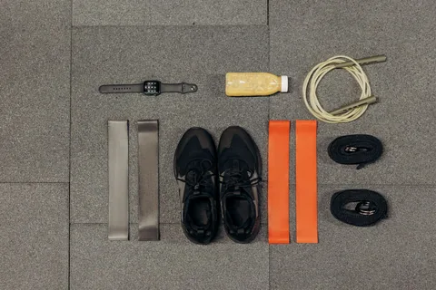 A selection of small exercise tools and training shoes.