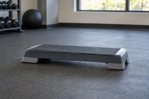 Low aerobic step with risers removed on a rubber floor.